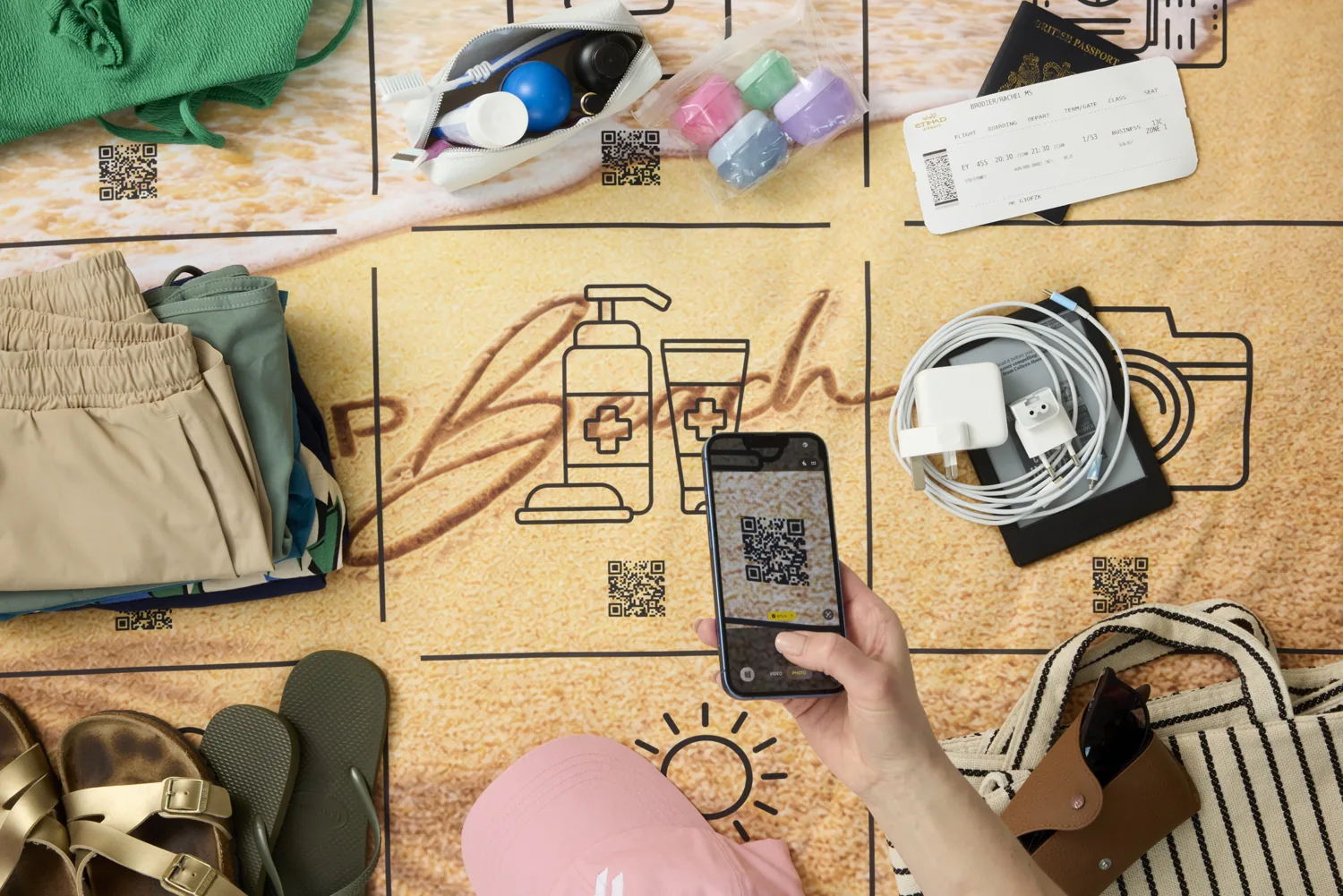 A phone scanning the QR code printed inside a Packmap square